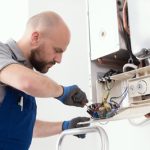 gas-engineer-repairing-boiler