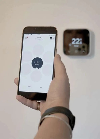 hive-mini-thermostat-and-app-on-phone